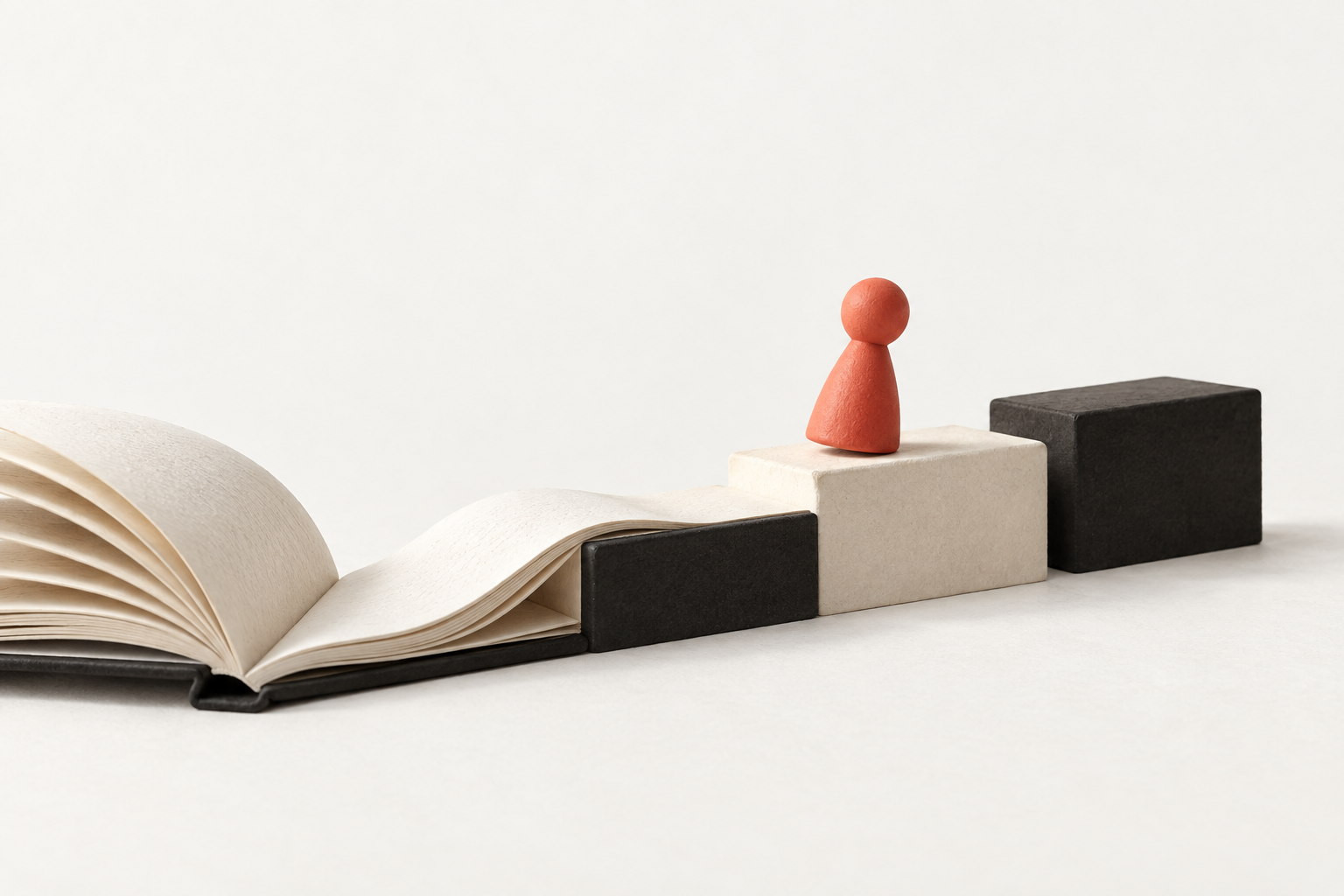 An open book becoming a small staircase, with one coral piece moving forward